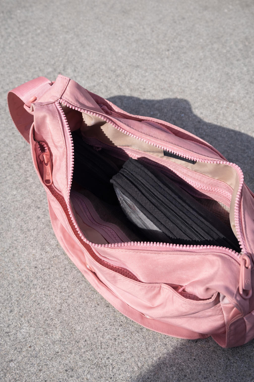 Citymouse NY Park Bag in Baby/ Pink with a plain strap, shown open to display the interior compartments and pockets