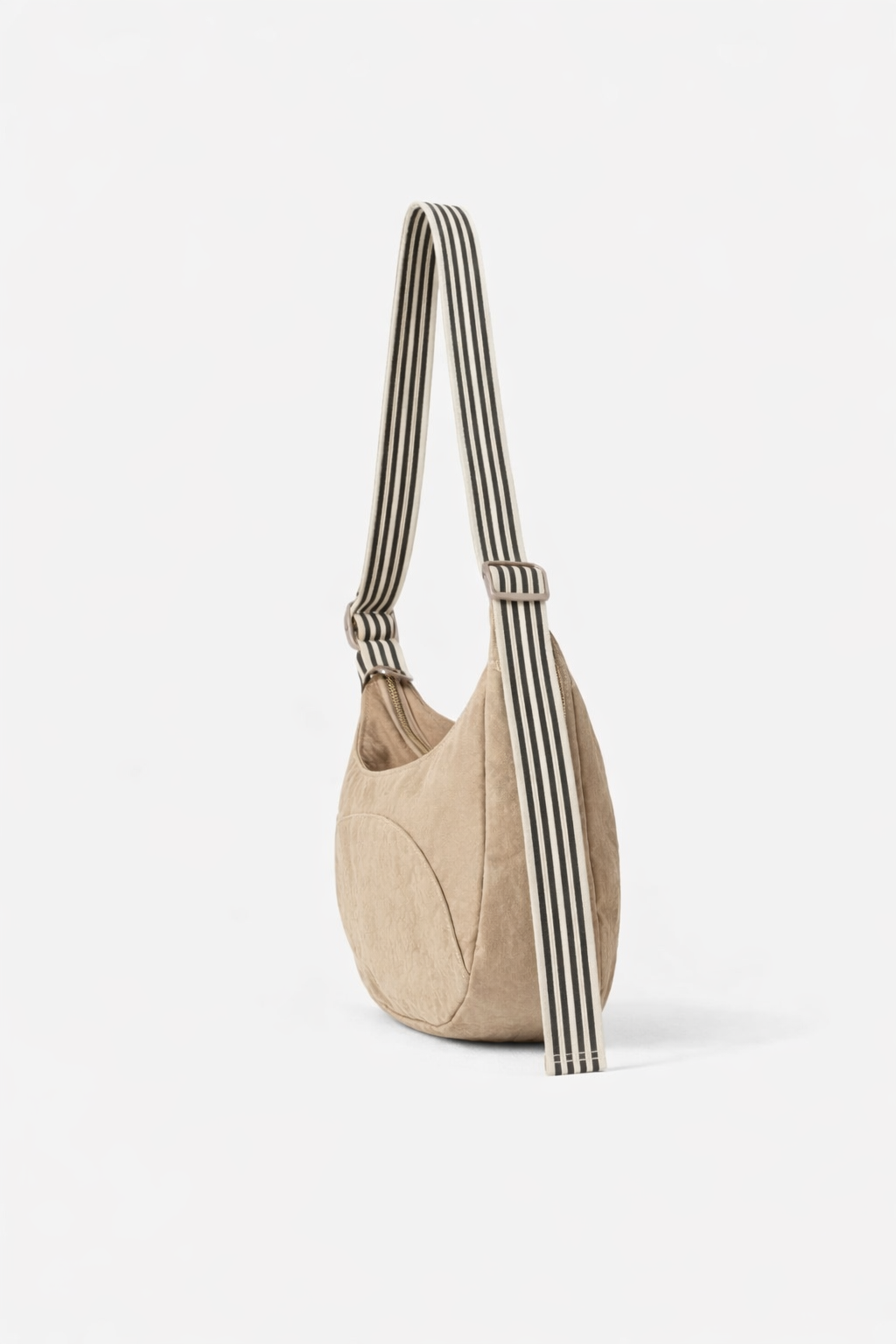 Beige handbag with striped handle on a white background