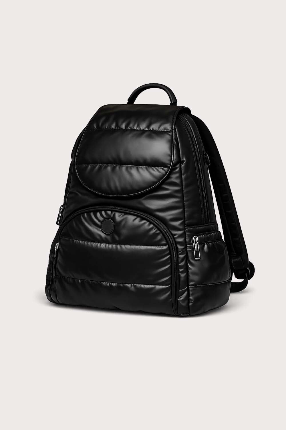 Sideview of Black puff backpack on a light beige background