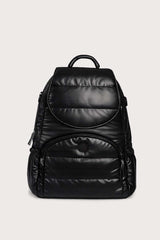 Black puff backpack on a light beige background