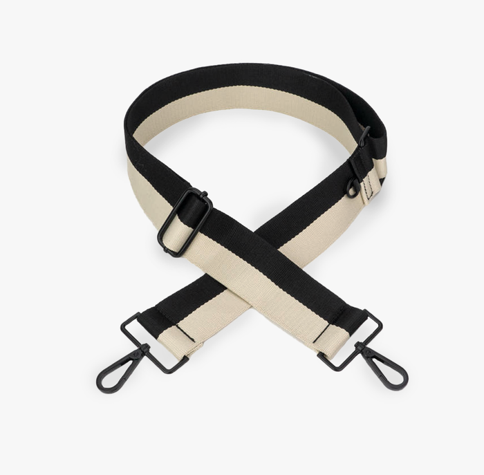 A black and cream colorblock strap with matte metal hardware and a woven cotton blend.